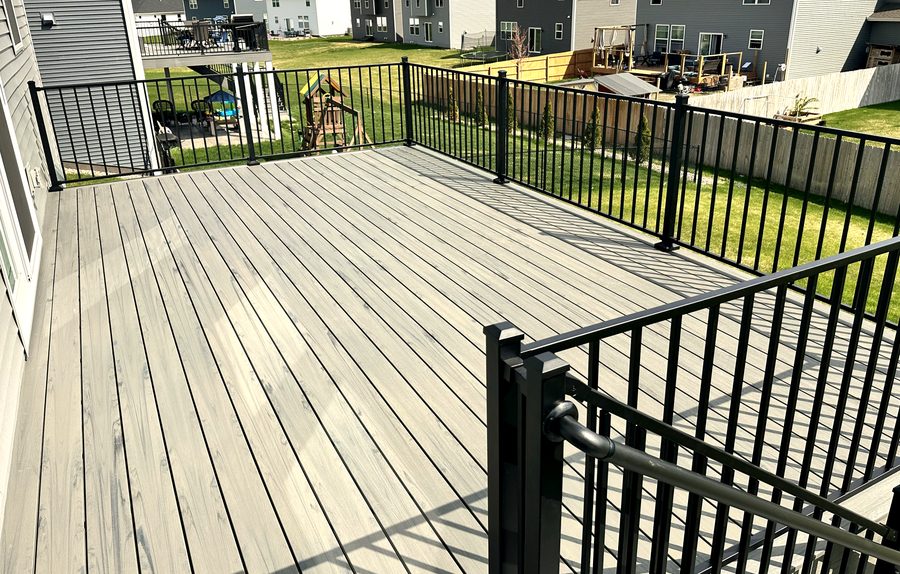 Composite deck with black aluminum railing — Central Oaks project