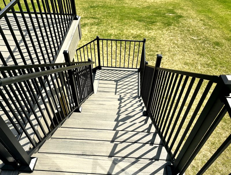 Composite staircase with aluminum railing and gate — Central Oaks project